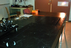 In this image, the thin beam of a filament laser is barely visible against the tabletop surface. (Photo by Pavel Polynkin) In this image, the thin beam of a filament laser is barely visible against the tabletop surface. (Photo by Pavel Polynkin)